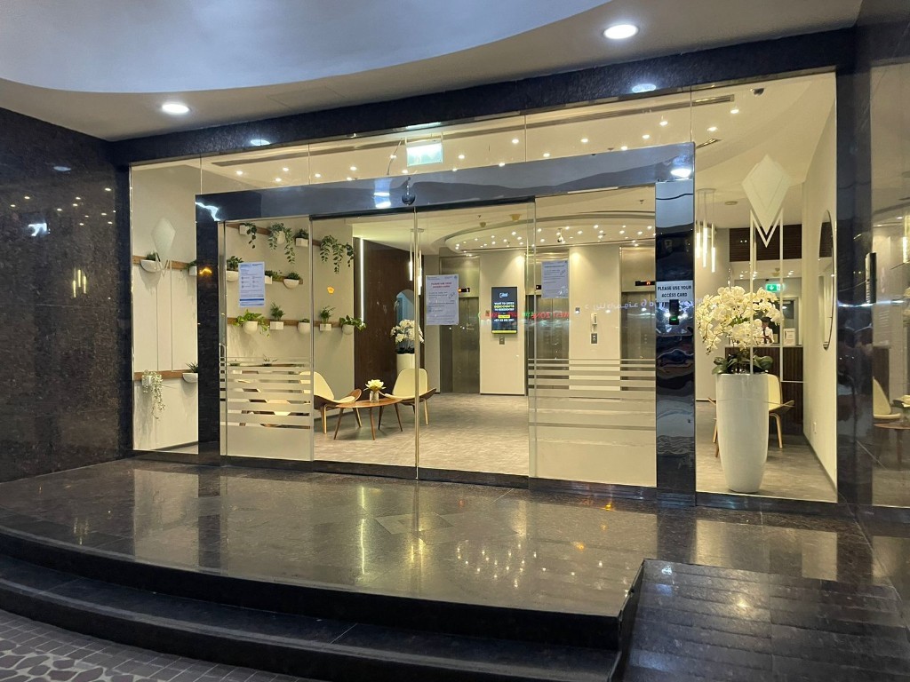 Diamond 5 glass entrance at night